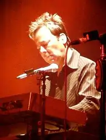 Photo of Lou Pardini, playing keyboards at a live concert