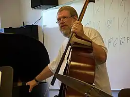 Lynn Seaton instructing a group of student horns