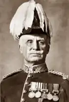 Man in British army General's uniform, moustached, looking authoritative