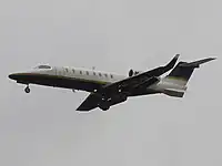 Learjet 45 flying, landing gear is out