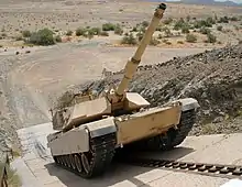 An M1 main battle tank climbs a 60° incline, part of performance testing at YTC.