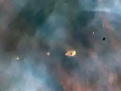 Image 30Hubble image of protoplanetary discs in the Orion Nebula, a light-years-wide stellar nursery probably very similar to the primordial nebula from which the Sun formed (from Formation and evolution of the Solar System)