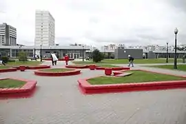 Park-like setup of benches near the entrance (the park is elevated above the surrounding streets)