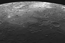 Lava-flooded craters and large expanses of smooth volcanic plains on Mercury.