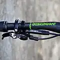 Control lever for a dropper post mounted on handlebars.