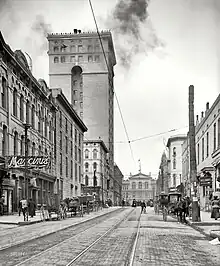 View west on Madison Avenue, with the building prominently featured on the left (1906)