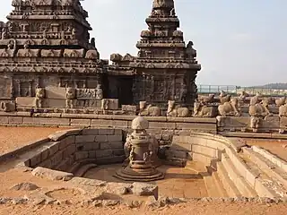 Two temples, dry pool and cattle sculptures