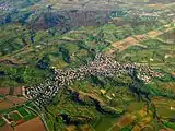 Aerial panorama of Malterdingen illustrates the hilly and forested terrain surrounding the village.