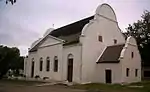 The Mission Station was founded in 1808 by Moravian missionaries on the site occupied by the Dutch East India Company's military outpost, "'t Groenekloof", from 1701 to 1791.
The old farm house (now the parsonage) was certainly built before 1770, and the original gable of the church building bears the date 1818, although later it was slightly altered.
Type of site: Mission Station. The Mission Station which is an important place of interest because of both its history and its architectural beauty, was founded in 1808 by Moravian missionaries on the site occupied by the Dutch East India Company's military outpost, "'t Groenekloof".