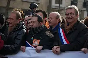 Regional councilor Jean-Luc Romero girds his scarf (2013).