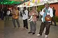 Musicians accompanying the dancers. Among the instruments used are the quijada and bote.