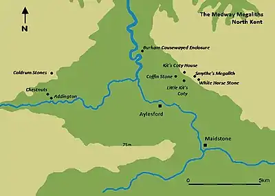 A map featuring a river moving from the top of the image (north) to the bottom right corner (southeast). Various black dots mark out the location of Medway Megaliths on either side of the river.