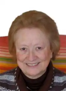 Headshot of a woman with brown hair