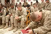 U.S. Marines observe a moment of silence at a memorial service to Valdez in June 2005.