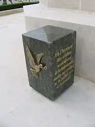 An inscribed stone at the base of the Cross of Sacrifice at Fromelles (Pheasant Wood) Military Cemetery