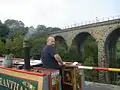 Working narrowboat on Marple Aqueduct, with the viaduct to the north