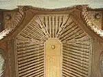 Painted and sculpted wood ceiling over one of the halls