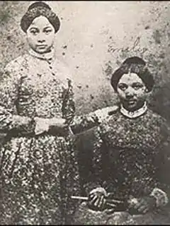 Mary Edmonson standing next to Emily Edmonson seated