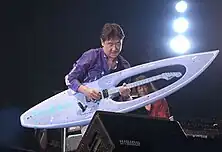 Masayoshi Takanaka with his blue "surfboard guitar"