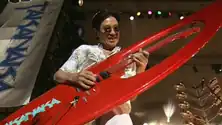 Masayoshi Takanaka with his red "surfboard guitar"