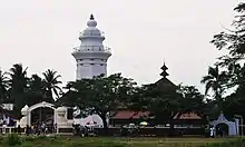 Two large buildings with a number of visitors