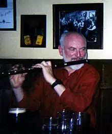 Molloy playing in a session at his pub in Westport, County Mayo, March 2000