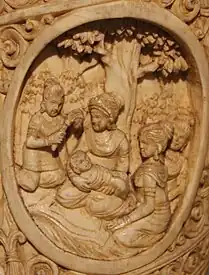 Mayadevi with her son Siddharatha This scene depicts the birth of Siddhartha, Prince of Kapilavastu in a different manner from other literary and sculptural narrations. Here Queen Mayadevi is shown seated with a baby in her lap surrounded by cauri-bearer and friends.