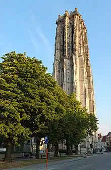 An ornate stone brick bell tower