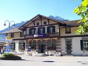 Three-story building with gabled roof