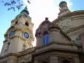 Another angle of the facade, with the clock tower in the background.