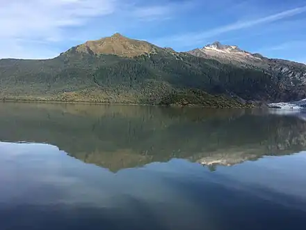 McGinnis and Stroller White reflected in Mendenhall Lake