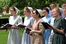 A Conservative Mennonite choir, with women choristers wearing kapps