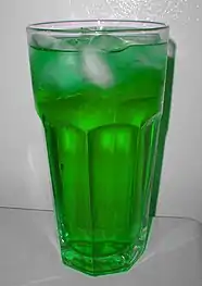 A mint-flavored soft drink prepared with mint syrup, water and ice