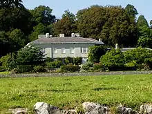 a large house surrounded by trees