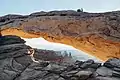 Monster framed by Mesa Arch