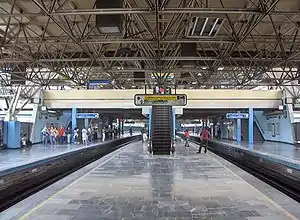 Picture of people waiting on the station's platforms.