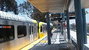 A westbound train at Palms station