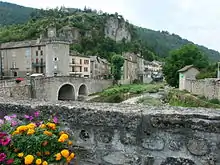 Clock tower and bridge over the Béthuzon in Meyrueis