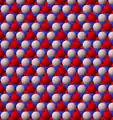 View of trioctahedral sheet structure of mica. The binding sites for apical oxygen are shown as white spheres.