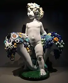 Secessionist putto with two cornucopias with floral cascades, very similar to the ones found in a lot of Art Deco of the 1910s and 1920s, by Michael Powolny, designed in c. 1907, produced in 1912, ceramic, Kunstgewerbemuseum Berlin