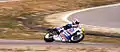 Mick Doohan, riding his Rothmans Honda NSR500 at the 1990 U.S. Grand Prix.