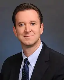 Head and shoulders of a Caucasian man wearing a suit