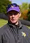 Mike Zimmer wearing a cap and sunglasses on top of his head