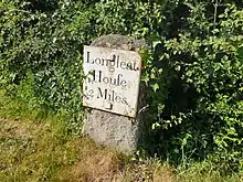 Milestone at East Woodlands, near the toll house.