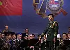 Band director Zhang Haifeng conducting a group of musicians in the Military Band of the Western Military District.