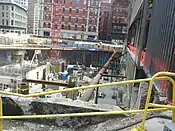 The Millennium Tower on May 2, 2014, with Filene's (Burnham Building) on the right