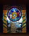 Decorative glass pane in Milwaukee City Hall, containing the seal