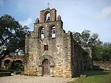 Stone church building with a tiered belltower