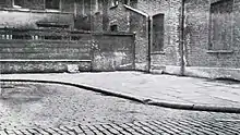 1938 photograph of Mitre Square.The body of Catherine Eddowes was discovered close to the fence seen at the centre of this image on 30 September 1888