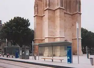 Covered shelters next to tracks in the street